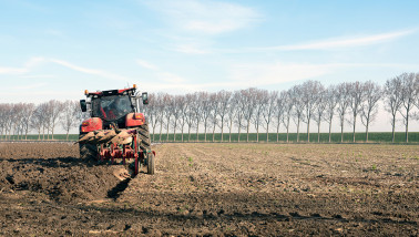 Tractor plowing the field to prepare the soil for planting