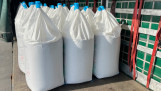 Fertilizer in big bags are ready to be unloaded in a truck